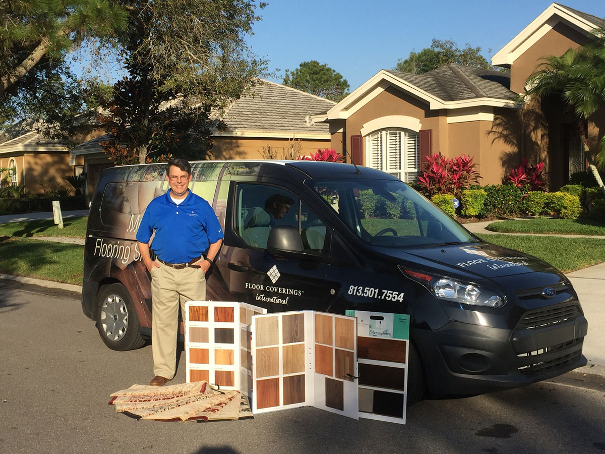 Floor Coverings International Franchise Owner in front of van